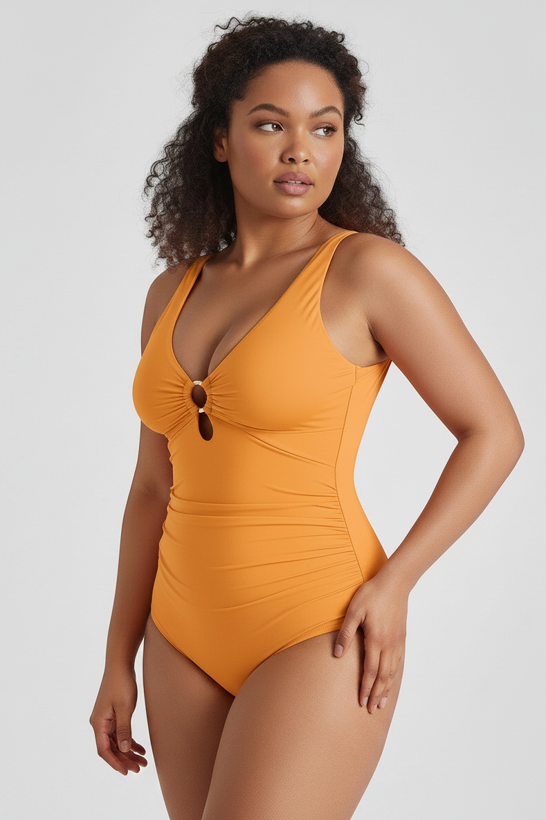 Woman wearing a mustard yellow swimsuit on a plain background