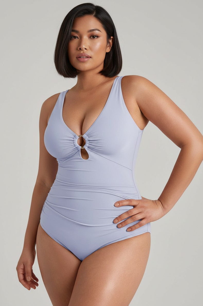 MODUS Swim™ light blue ruched one-piece swimsuit with deep V-neck, gold ring detail, and wide straps.