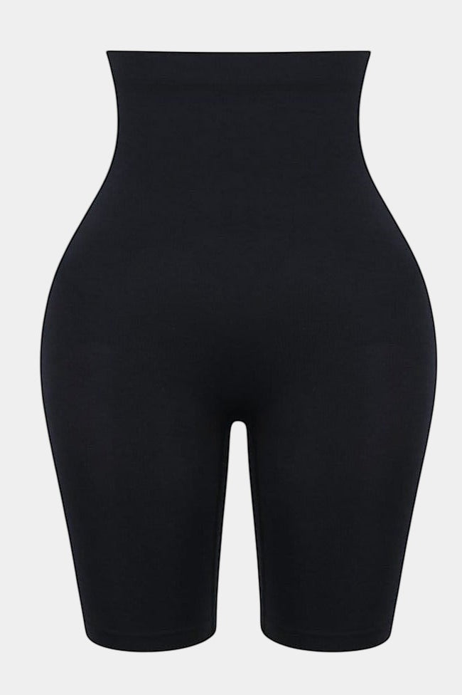 Modusactive black seamless high-waist butt lifter shorts made of nylon and elastane for tummy control and shaping.