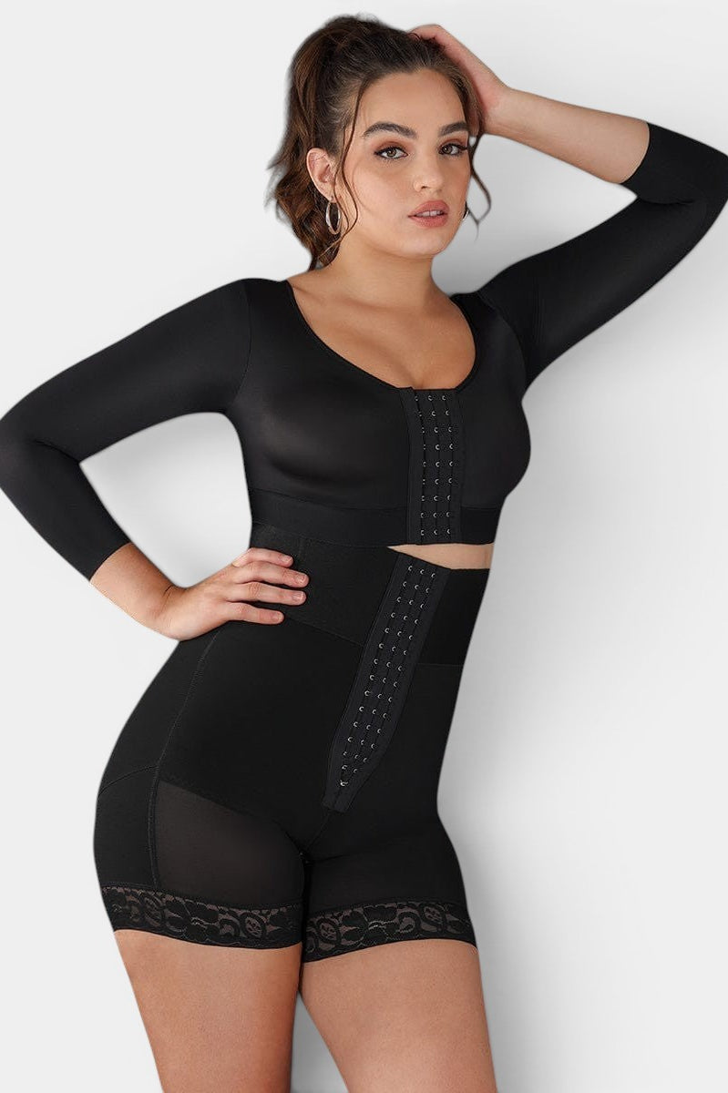 Black long-sleeve MODUS Sculpt™ Triple-Closure Bodysuit with high waist, tummy control, and lace trim. Model is wearing a size XL.