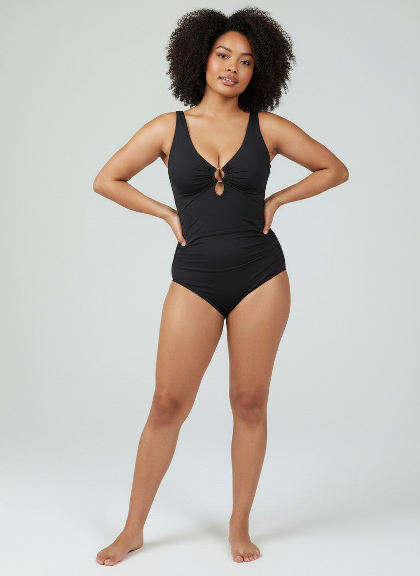 www.modusactive.com black ruched V-neck one-piece swimsuit with gold ring detail and wide straps.