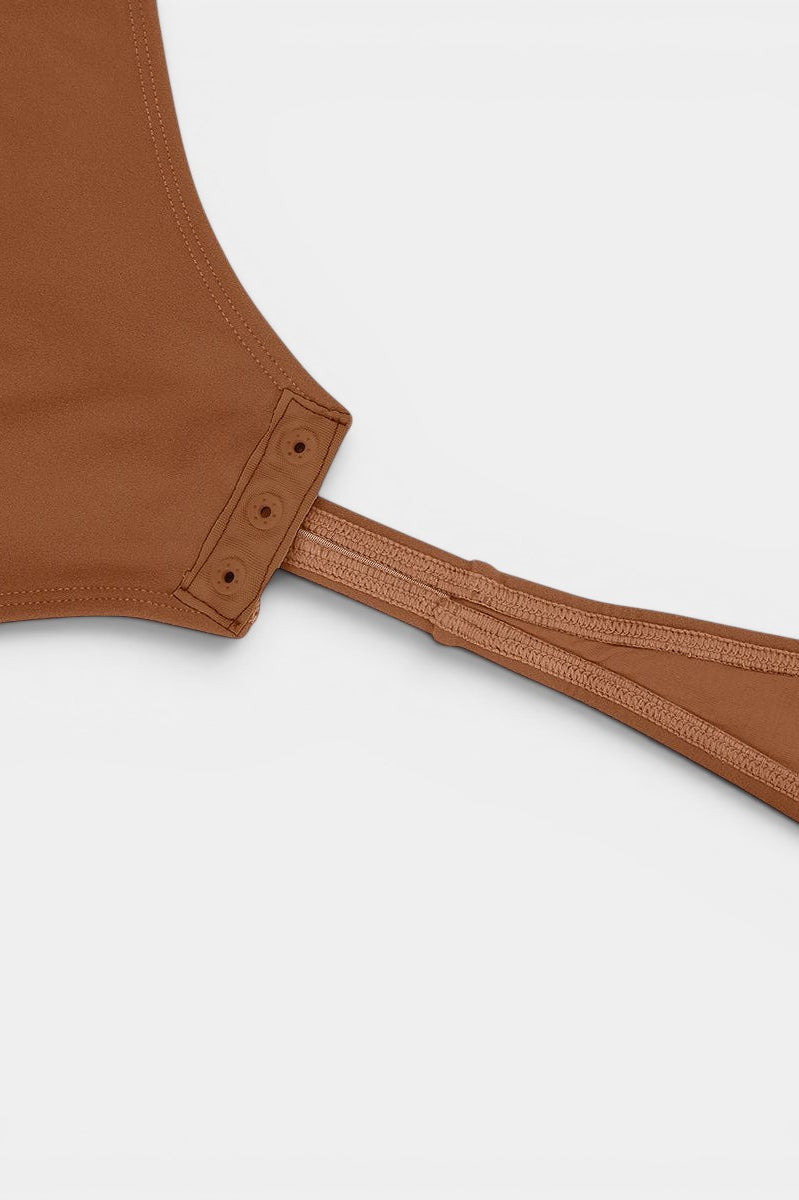 www.modusactive.com brown nylon-spandex long-sleeve V-neck bodysuit with snap closure