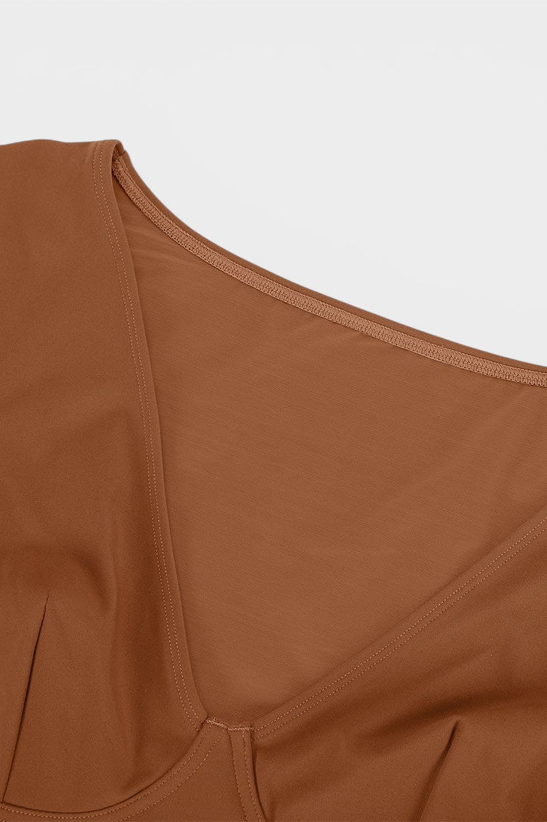 www.modusactive.com Sculpt V-neck bodysuit in brown nylon and spandex blend with thong back and snap closure.