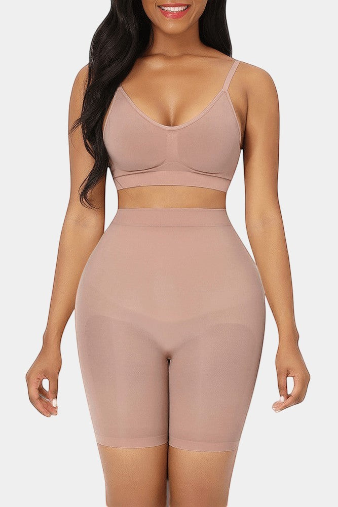 Nude seamless high-waist butt lifter shorts made of nylon and elastane. Invisible under clothing, flattens stomach.