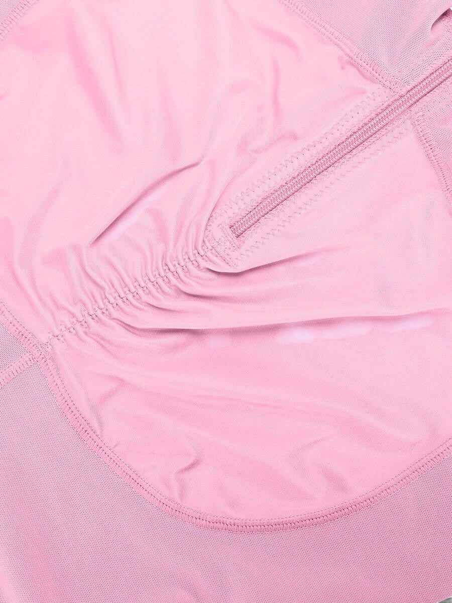 www.modusactive.com pink nylon and spandex bodysuit with triple closure, ruched front, and mesh panels.