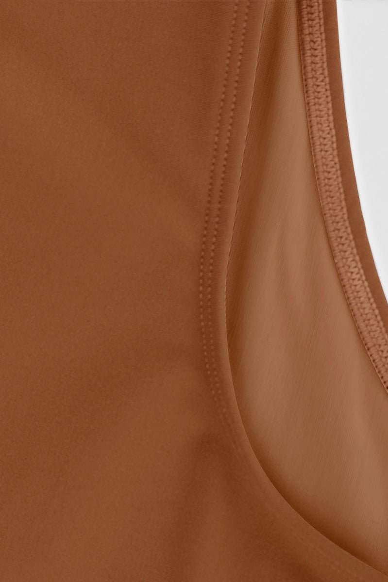www.modusactive.com Sculpt V-Neck Bodysuit in brown nylon and spandex blend with a figure-hugging fit and thong styling.