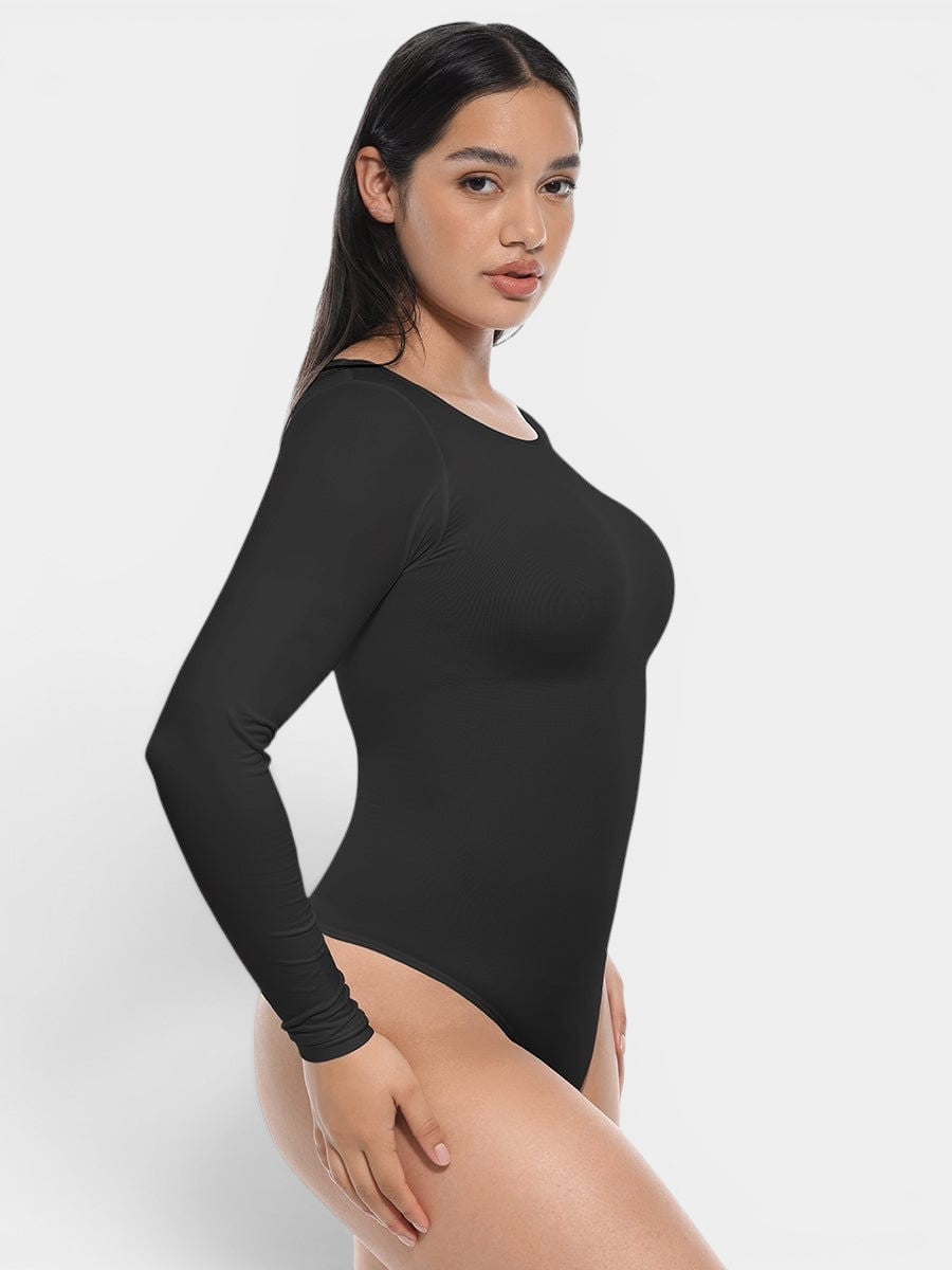 www.modusactive.com black long sleeve bodysuit made of nylon and spandex with tummy and arm slimming features.