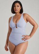 MODUS Swim™ light blue ruched one-piece swimsuit with deep V-neck, gold ring detail, and wide straps.