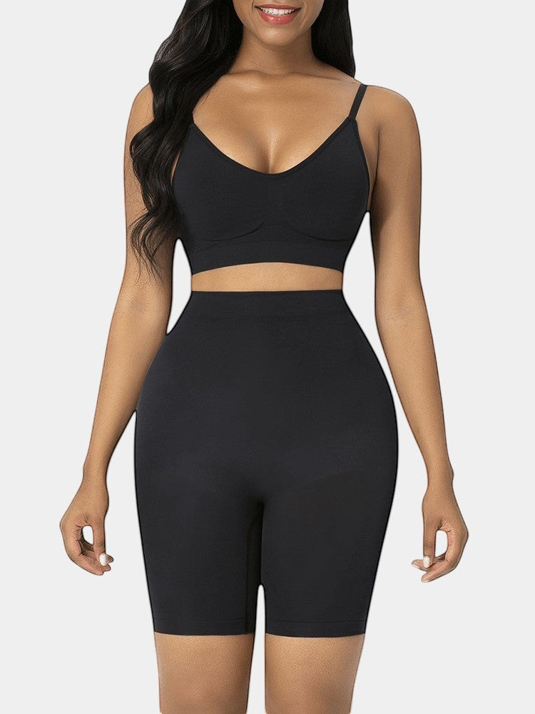 Black seamless high-waist butt lifter shorts made of nylon and elastane, designed for tummy control and slimming.