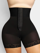www.modusactive.com black high-waist bodysuit with triple hook-and-eye closure, zipper, and lace trim. Nylon and spandex.