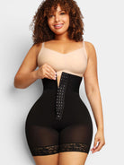 MODUS Sculpt™ black high-waist bodysuit with triple-closure front, lace trim, and tummy control. Made of nylon and spandex.