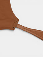 www.modusactive.com brown nylon-spandex long-sleeve V-neck bodysuit with snap closure