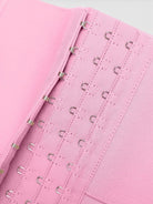www.modusactive.com pink triple-closure bodysuit with 3 rows of hooks and boning for waist support.