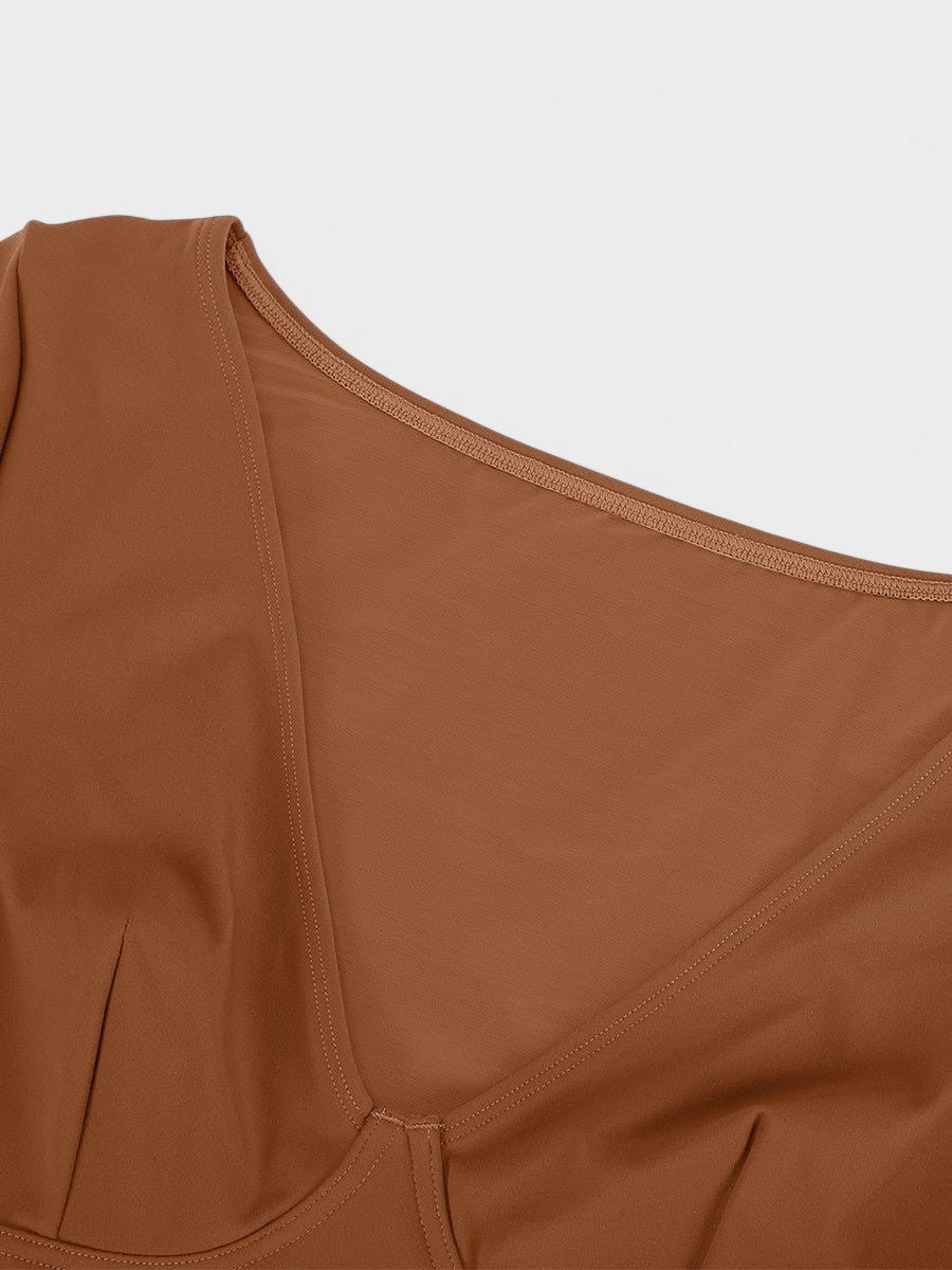 www.modusactive.com Sculpt V-neck bodysuit in brown nylon and spandex blend with thong back and snap closure.
