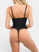 MODUS Sculpt™ Contour Bodysuit in black nylon and spandex with adjustable straps and thong back.