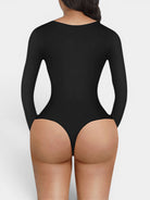 www.modusactive.com black long-sleeve V-neck bodysuit with thong back and tummy control