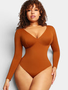 www.modusactive.com Sculpt™ V-Neck Bodysuit in rust brown, long sleeve, thong back, and snap closure.